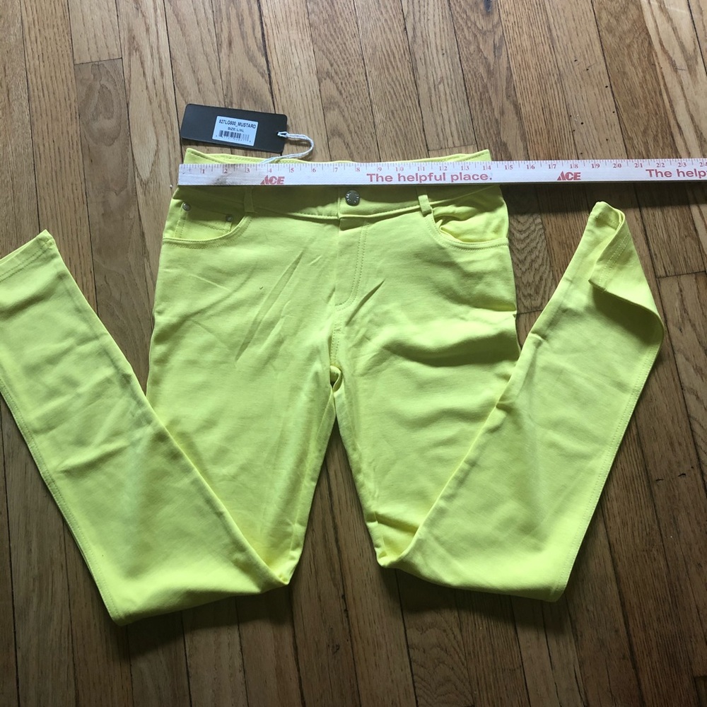 NWT bright yellow stretchy jeans. SZ L